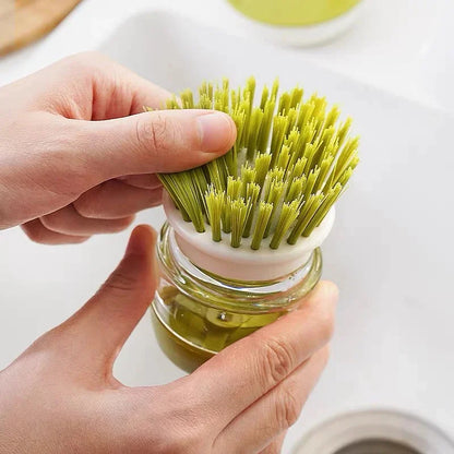 Washing-up brush with soap dispenser