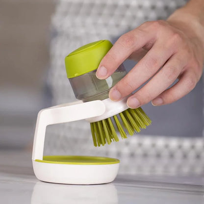 Washing-up brush with soap dispenser